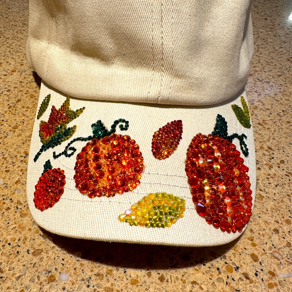One size fits all, adjustable ball cap style hat.
